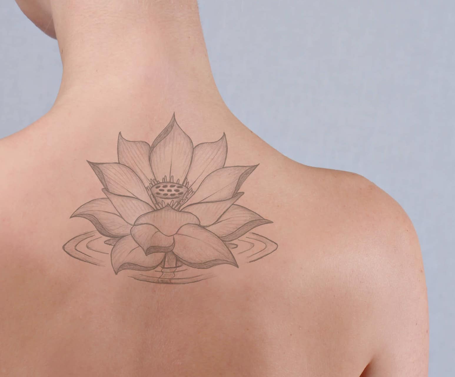 a woman seen from behind with a fading tattoo